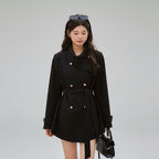 Black elegant trench coat for women with long sleeves and refined design